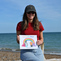 The author with the Corona Kindness book